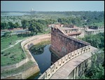 Agra Fort's ramparts with distant Taj Mahal